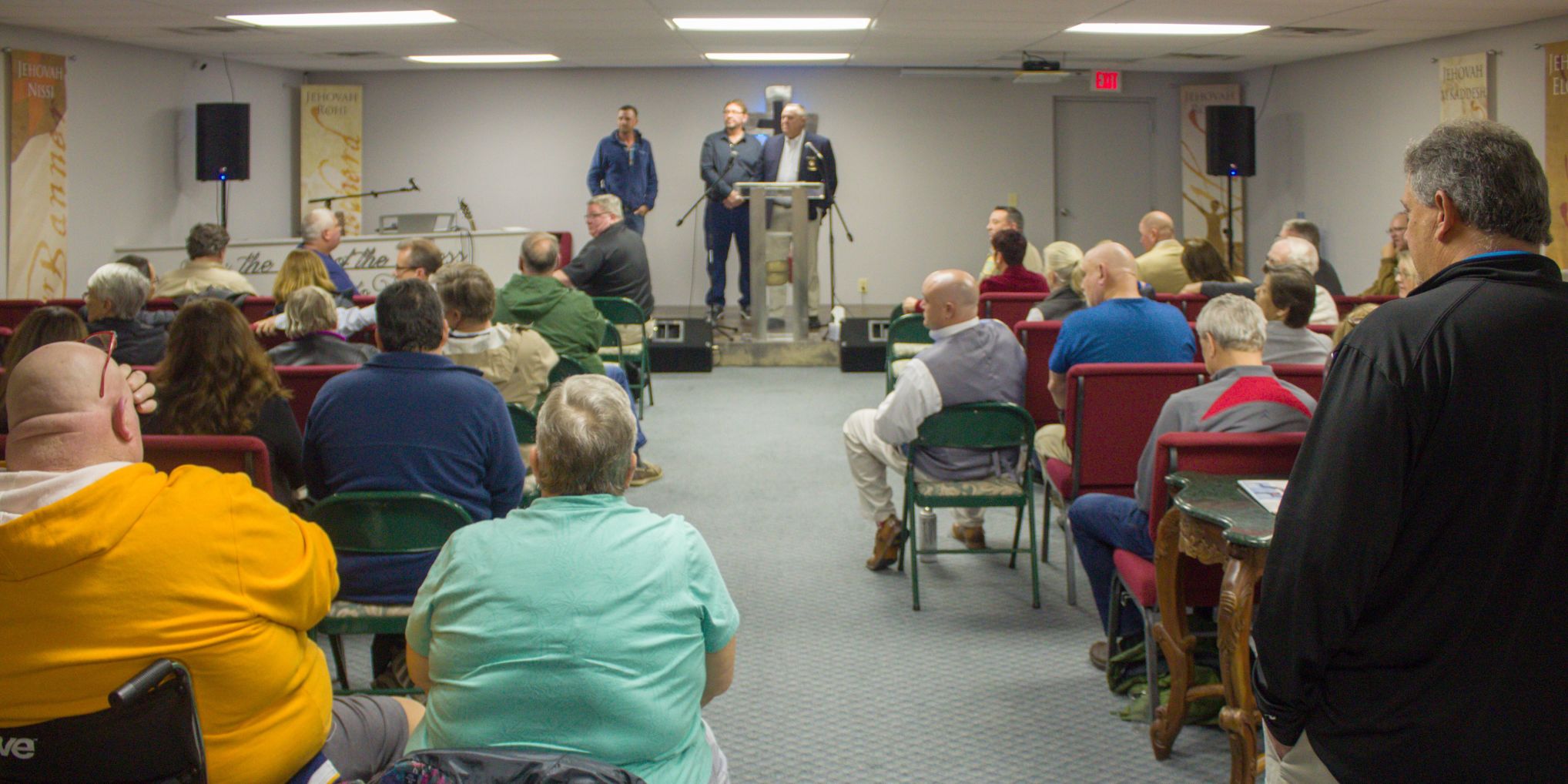Cliff Brown, Jon Rachels and Sheriff Ronnie Fields address an audience of more than 50 people Tuesday at Crossway Church of Worship in Aberdeen.